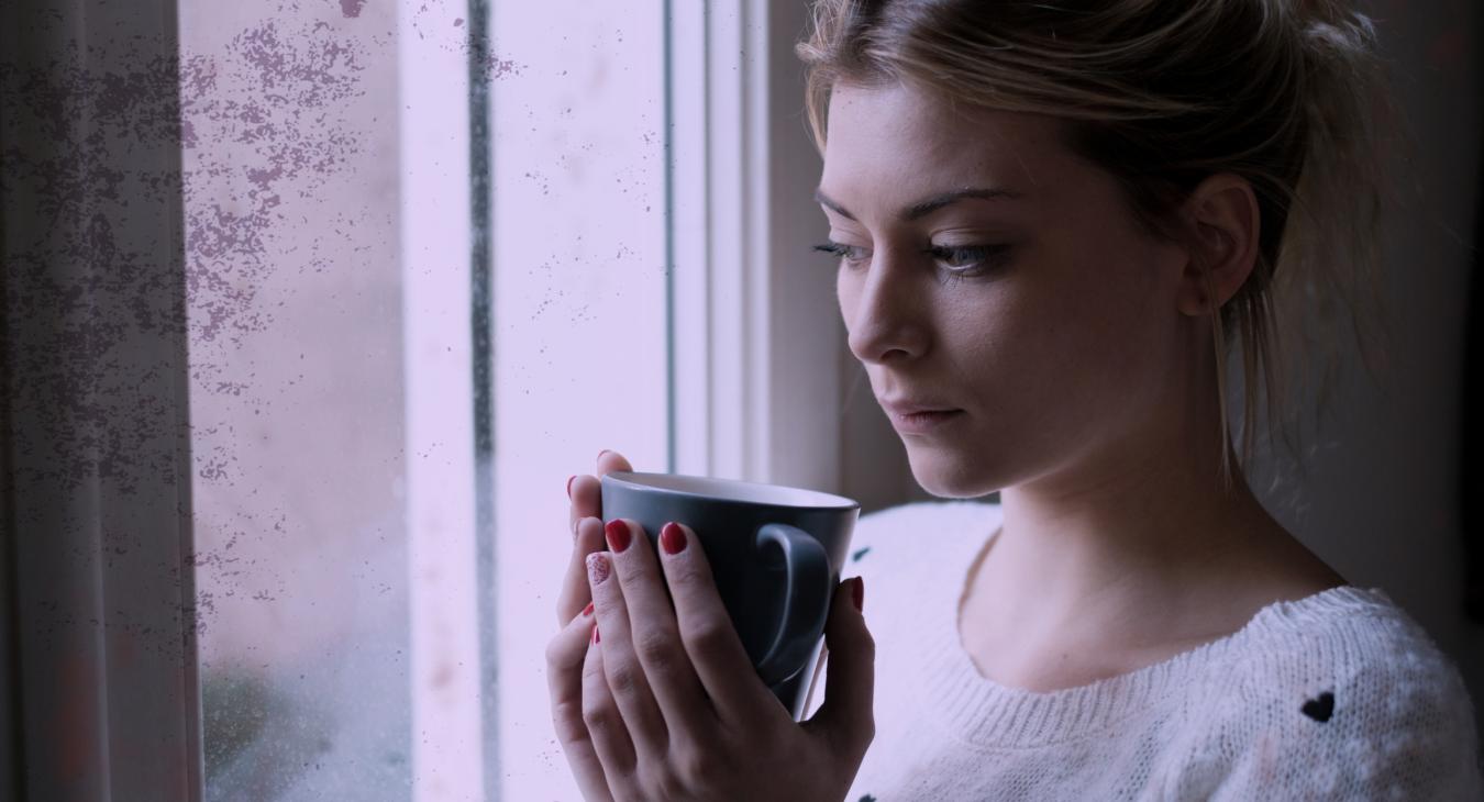 Woman window coffee